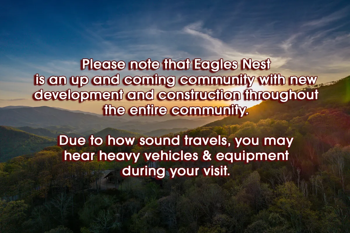 This image captures a sweeping view of a mountain range at sunset, with lush vegetation in the foreground. The scene feels open and welcoming, showcasing the area's natural beauty and the expansive outdoor environment awaiting guests and their pets.